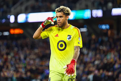 Dayne St. Clair points towards his head