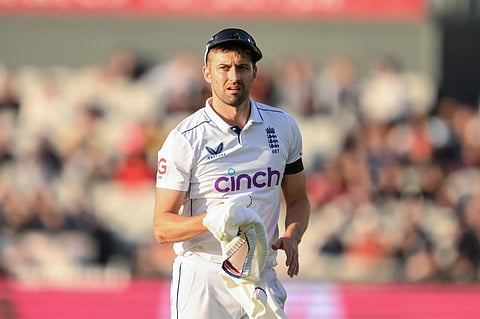Mark Wood in action in whites