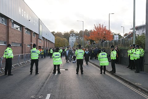 UK police in front of a football stadium