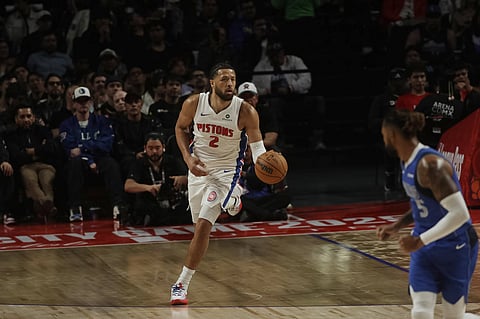 Cade Cunningham drives forward with the ball