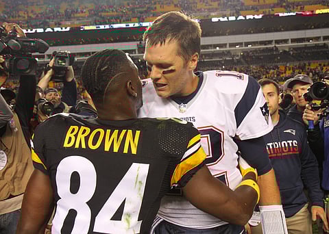 Antonio Brown hugs Tom Brady