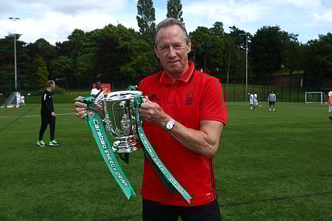 John Robertson posing with the Carabao Cup
