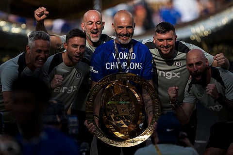 Enzo Maresca poses with the FIFA Club World Cup trophy