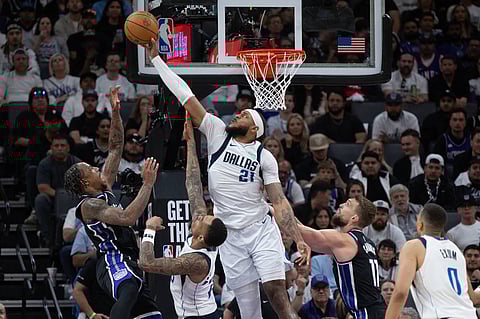 Dallas Mavericks and Sacramento Kings players in action 