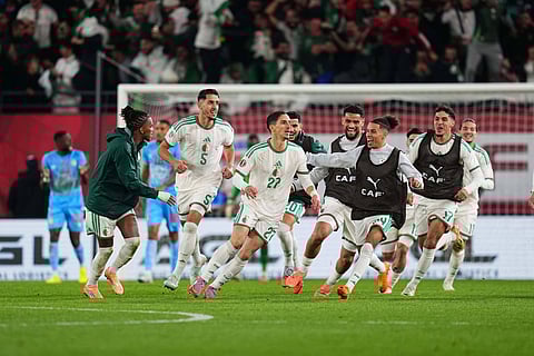 Adil Boulbina and his teammates celebrate the winning goal against Congo