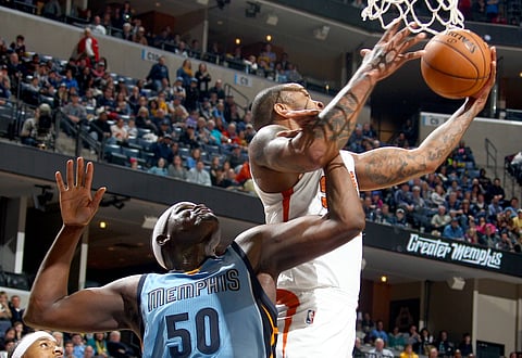 Memphis Grizzlies  and Phoenix Suns players battle for a rebound