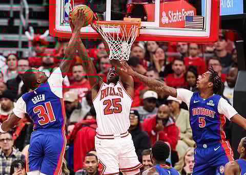 Detroit Pistons and Chicago Bulls players compete during the game