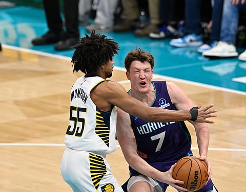 Indiana Pacers and Charlotte Hornets players in action