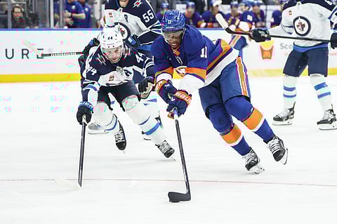 Winnipeg Jets and New York Islanders players in action
