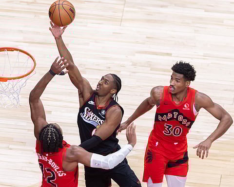 Tyrese Maxey (C) of Philadelphia 76ers goes up for a layup