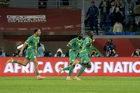 Players of Senegal celebrate after scoring against Egypt