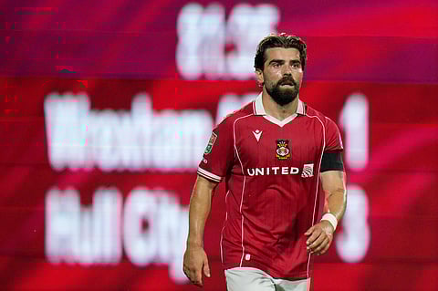 Elliot Lee of Wrexham in action