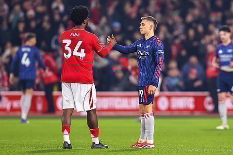 Ola Aina and Leandro Trossard shakes hand at full-time