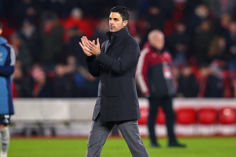 Mikel Arteta applauds the travelling fans at full-time
