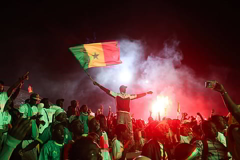 Senegal fans celebrate in the streets of Dakar