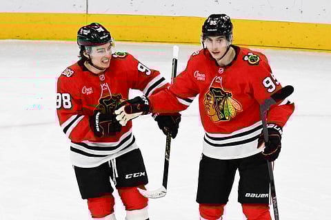 Chicago Blackhawks players celebrate after scoring against Winnipeg Jets