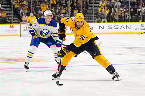 Buffalo Sabres and Nashville Predators players in action
