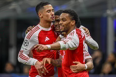 Arsenal players celebrate their goal against Inter Milan