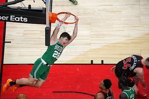 Boston Celtics' Hugo Gonzalez dunks the ball