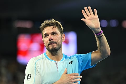 Stan Wawrinka applauds the fans after his final Australian Open game