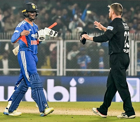 India's Abhishek Sharma shares a handshake with New Zealand'sGlenn Phillips