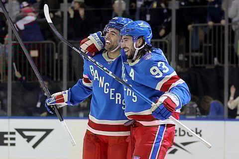 New York Rangers players celebrate against Boston Bruins