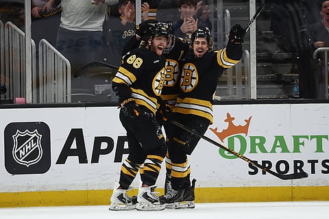 David Pastrnak celebrates after scoring the goal in overtime