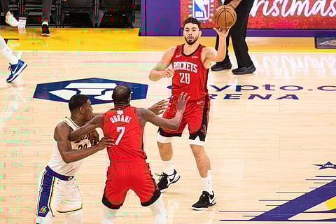 Alperen Sengun and Kevin Durant in action 