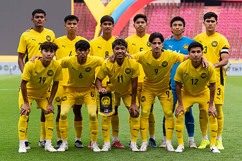 Malaysia team pose for a group photo