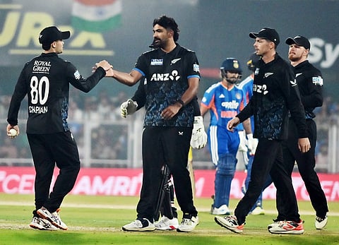 New Zealand cricketers celebrate a wicket