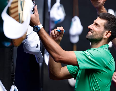 Novak Djokovic greets the audience after his match against Lorenzo Musetti
