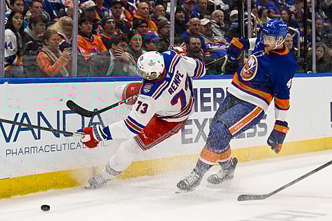 New York Islanders and New York Rangers players in action