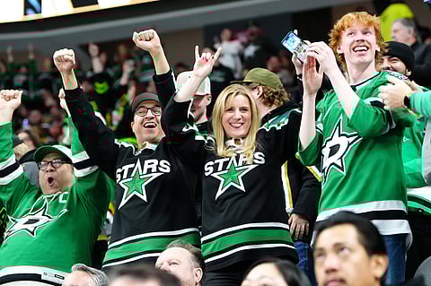 Dallas Stars fans celebrate a goal