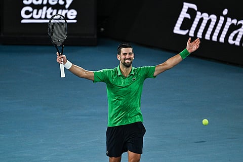 Novak Djokovic celebrates after beating Jannik Sinner