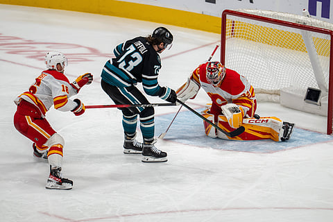San Jose Sharks and Calgary Flames players in action
