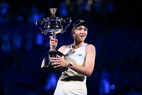 Elena Rybakina poses with the Australian Open trophy 