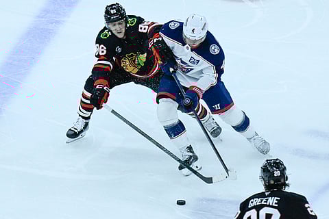 Columbus Blue Jackets and Chicago Blackhawks players in action
