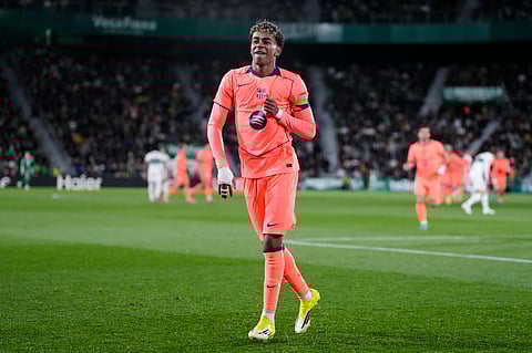 Lamine Yamal celebrates after scoring Barcelona's first goal