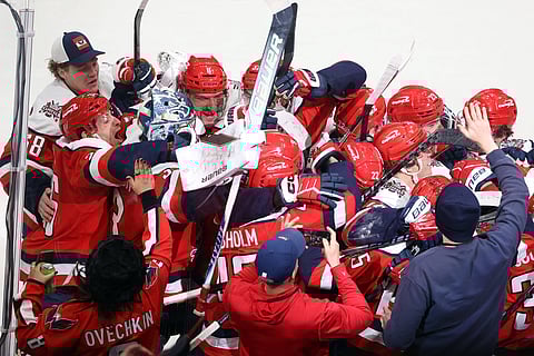 Washington Capitals players celebrate after win over Carolina Hurricanes
