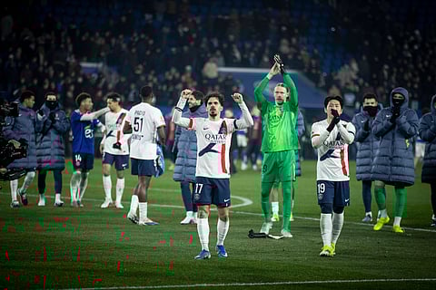 Paris St Germain players applaud the fans after win over Strasbourg