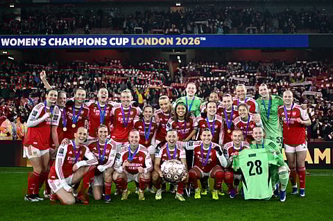 Arsenal players pose with the FIFA Women's Champions Cup Trophy