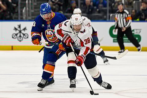 Players of Washington Capitals and New York Islanders in action