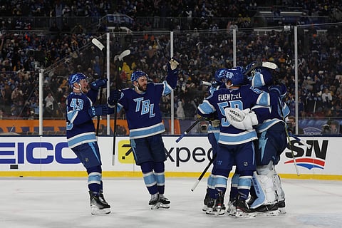 Tampa Bay Lightning players celebrate their win over Boston Bruins