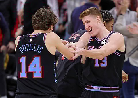 Chicago Bulls players celebrate during an NBA match