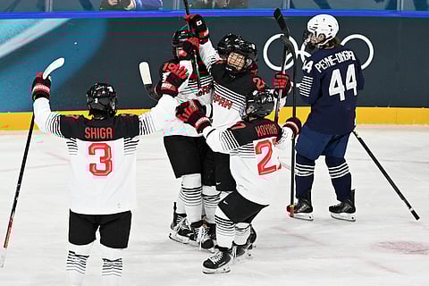 Japan team celebrates their goal against France