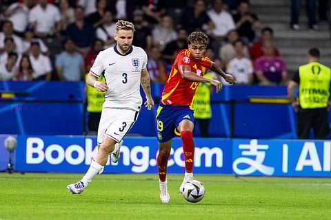 Luke Shaw and Lamine Yamal in action during EURO 2024 final