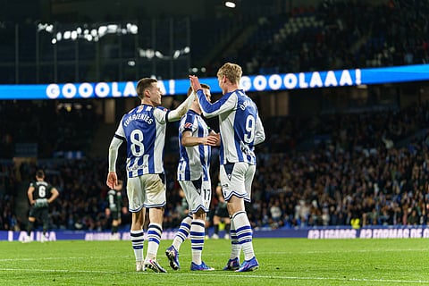 Benat Turrientes celebrates his goal with teammates
