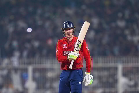 Tom Banton raises his bat after reaching fifty runs against Scotland