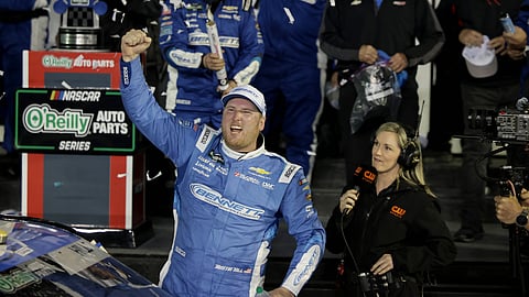Austin Hill celebrates winning the NASCAR