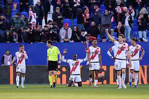Rayo Vallecano players celebrate their goal against Atletico Madrid
